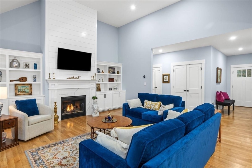 36 Ralyn Road Barnstable, MA 02635 - Photo 18 of 39 a living room with furniture a flat screen tv and a fireplace