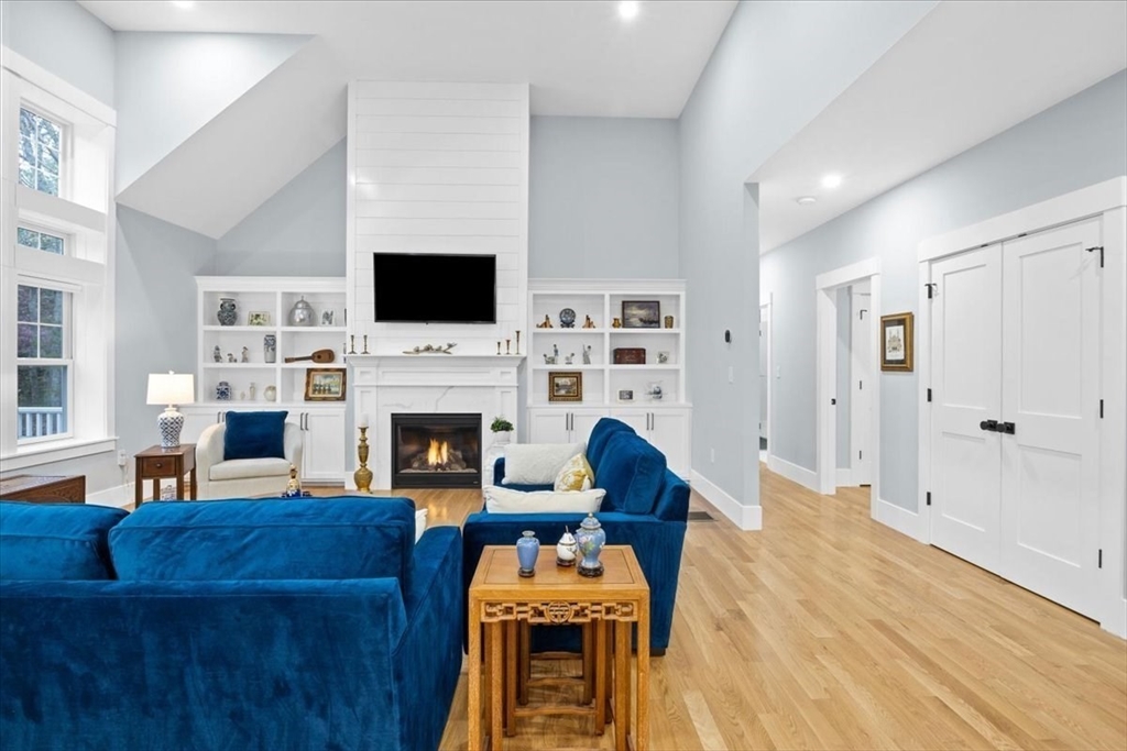 36 Ralyn Road Barnstable, MA 02635 - Photo 19 of 39 a living room with furniture a flat screen tv and a fireplace