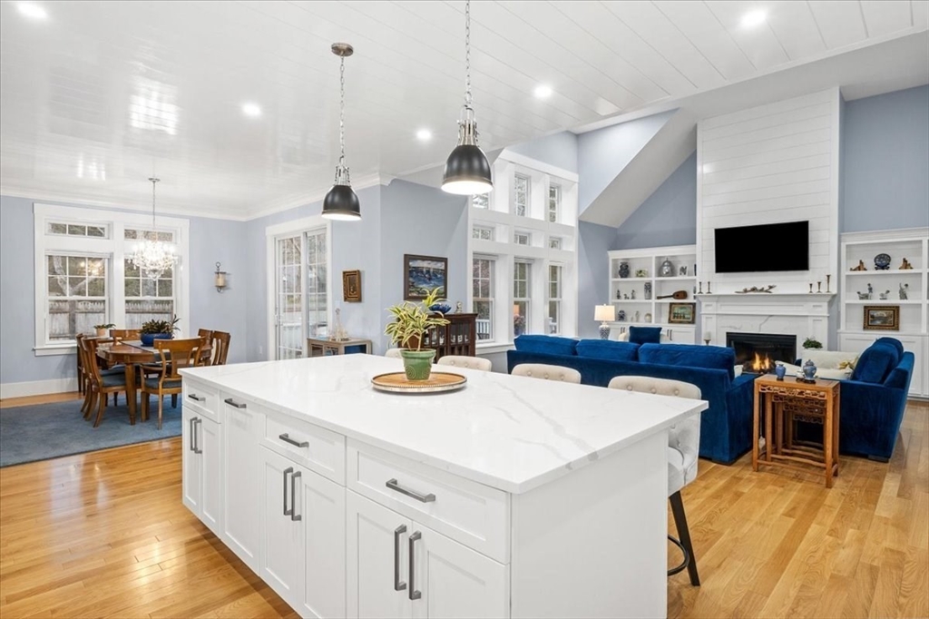 36 Ralyn Road Barnstable, MA 02635 - Photo 21 of 39 a large kitchen with sink a refrigerator and chairs