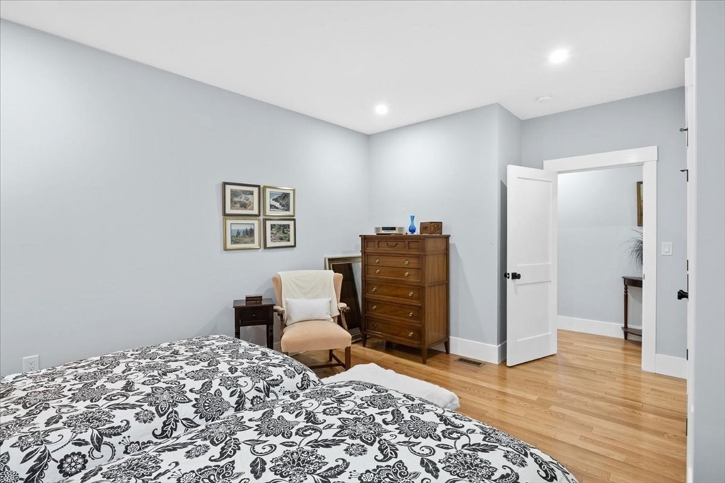 36 Ralyn Road Barnstable, MA 02635 - Photo 27 of 39 a bedroom with a bed and wooden floor