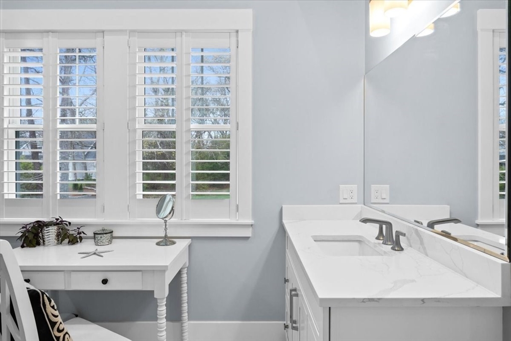 36 Ralyn Road Barnstable, MA 02635 - Photo 28 of 39 a bathroom with a sink double vanity and windows