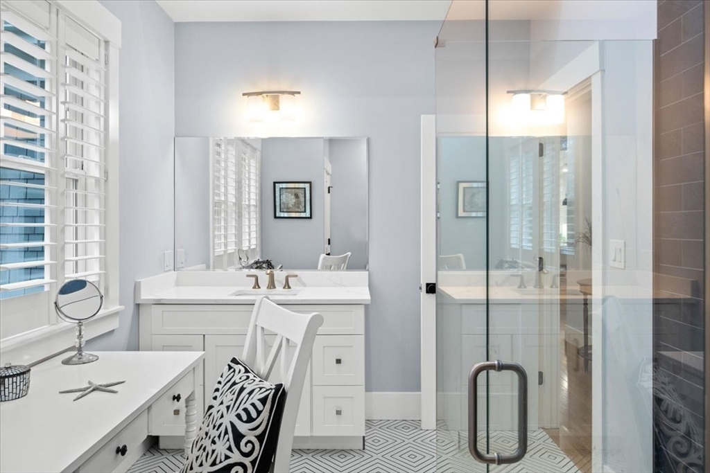 36 Ralyn Road Barnstable, MA 02635 - Photo 29 of 39 a bathroom with a double vanity sink mirror and shower