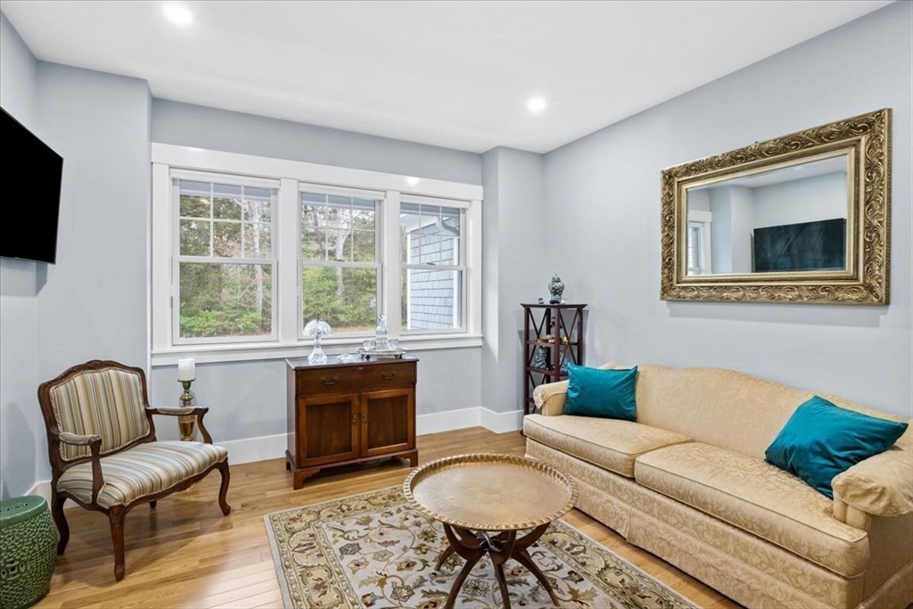 36 Ralyn Road Barnstable, MA 02635 - Photo 3 of 39 a living room with furniture a flat screen tv and a window