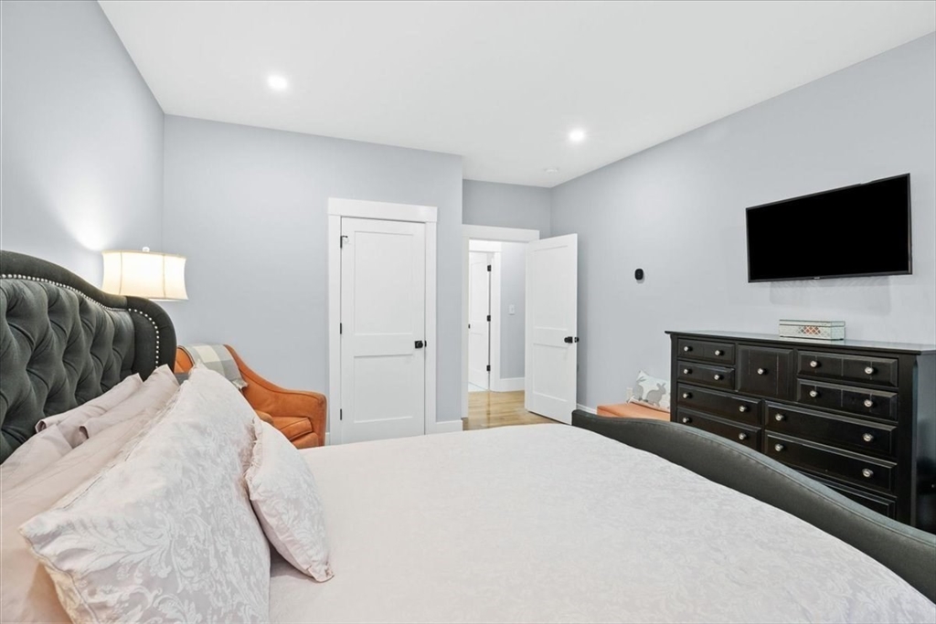 36 Ralyn Road Barnstable, MA 02635 - Photo 34 of 39 a bedroom with a bed and a flat screen tv