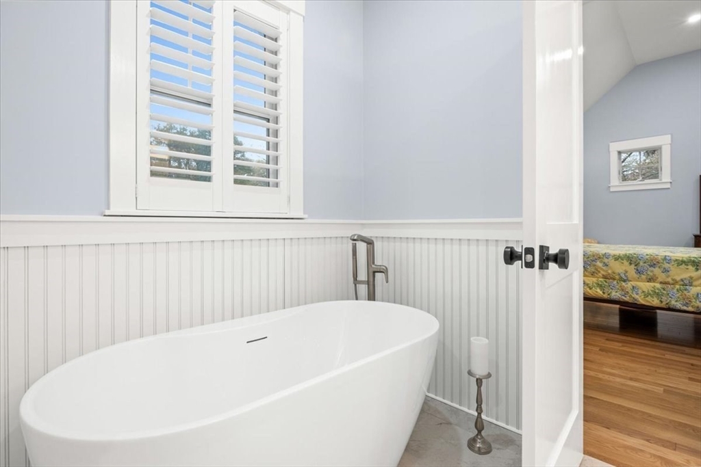 36 Ralyn Road Barnstable, MA 02635 - Photo 7 of 39 a white bath tub sitting next to a window