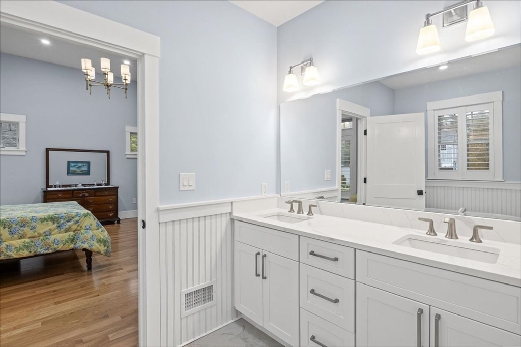 36 Ralyn Road Barnstable, MA 02635 - Photo 8 of 39 a en suite bathroom with double sink and a mirror