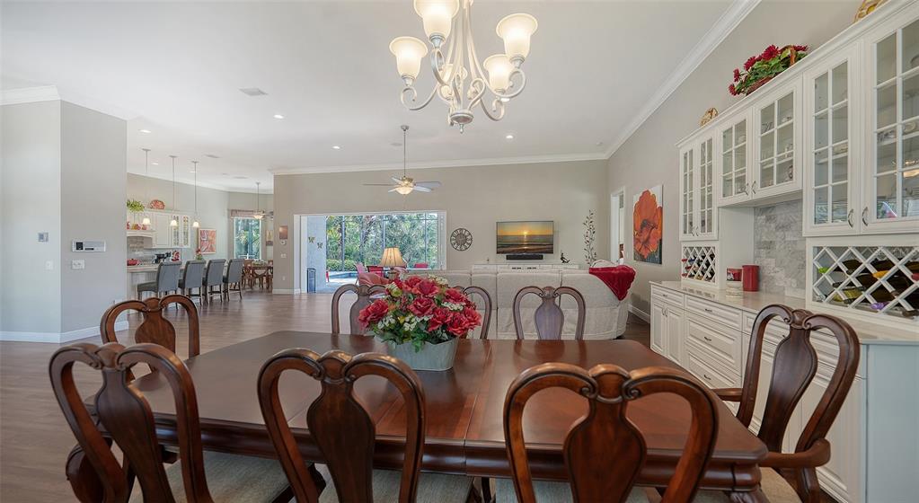 20 Bayhead Lane Osprey, FL 34229 - Photo 17 of 72 a dining room with furniture and chandelier