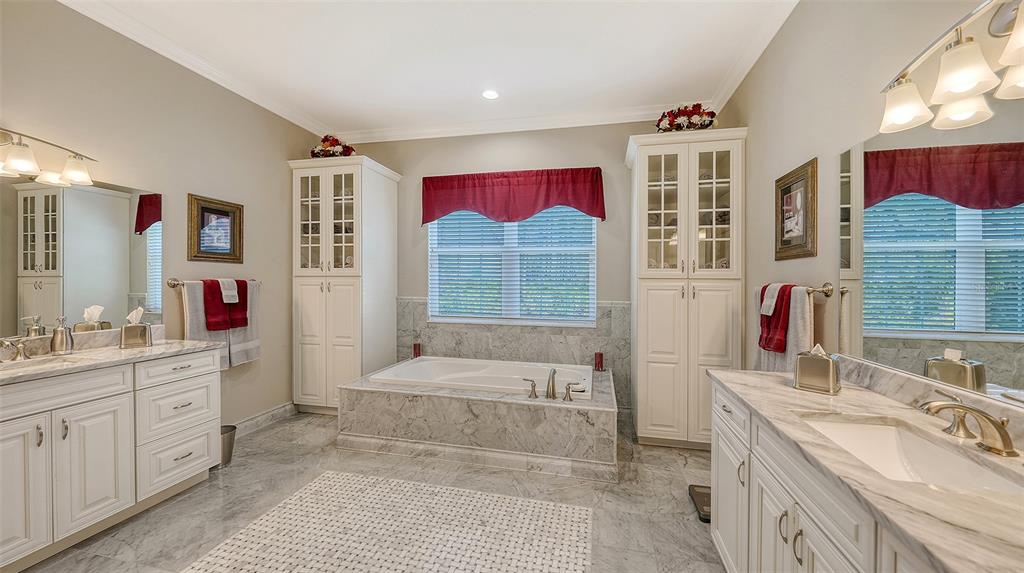 20 Bayhead Lane Osprey, FL 34229 - Photo 22 of 72 a spacious bathroom with a sink double vanity granite and a mirror