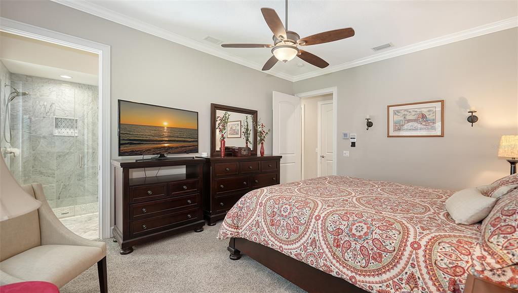 20 Bayhead Lane Osprey, FL 34229 - Photo 31 of 72 a bedroom with a bed and a television