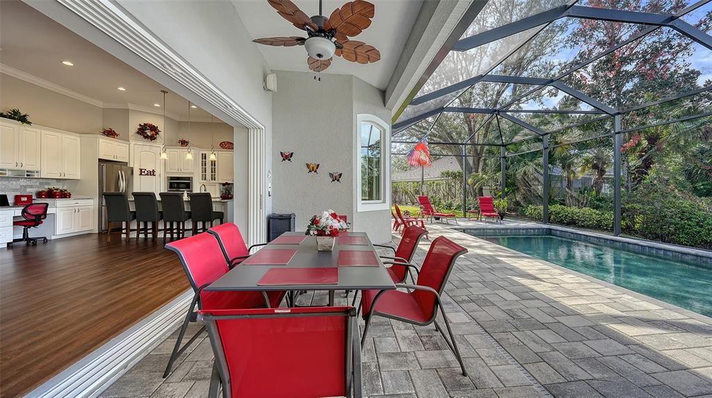 20 Bayhead Lane Osprey, FL 34229 - Photo 35 of 72 a view of a dining room with furniture window and wooden floor