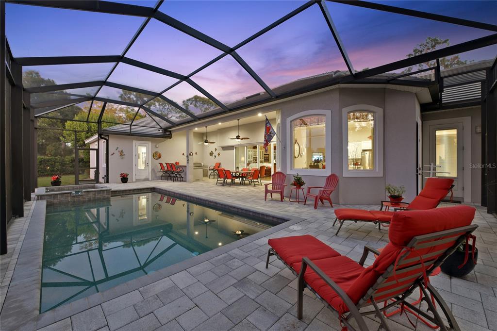 20 Bayhead Lane Osprey, FL 34229 - Photo 43 of 72 a outdoor living space with furniture and umbrella