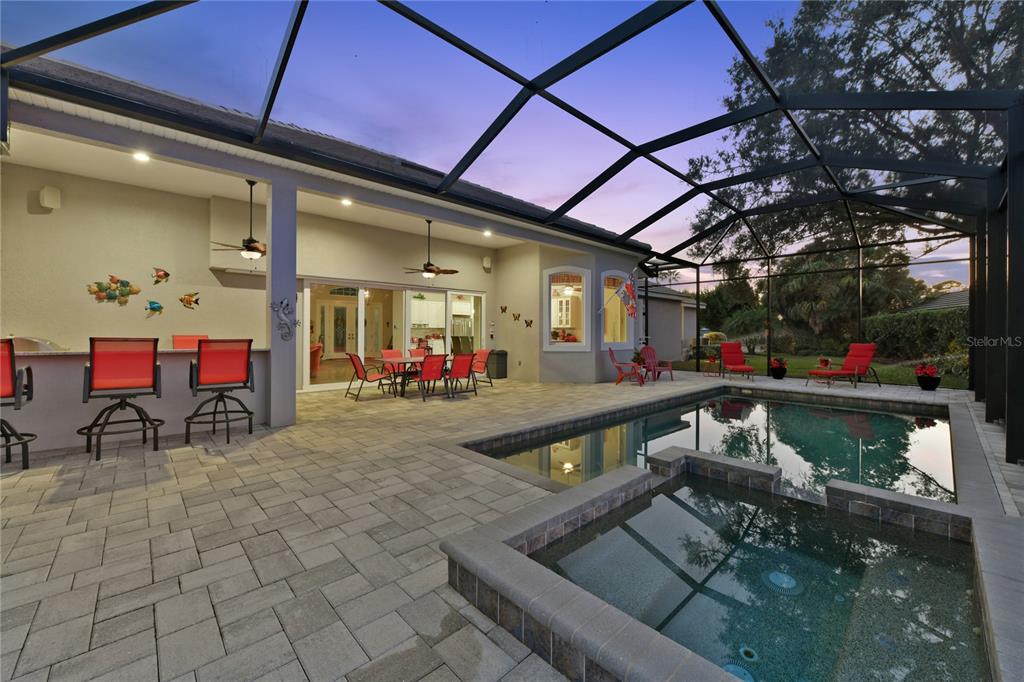 20 Bayhead Lane Osprey, FL 34229 - Photo 46 of 72 a outdoor living space with furniture and a fireplace