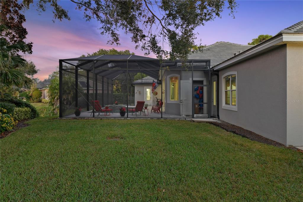 20 Bayhead Lane Osprey, FL 34229 - Photo 50 of 72 a view of a porch with furniture and a yard