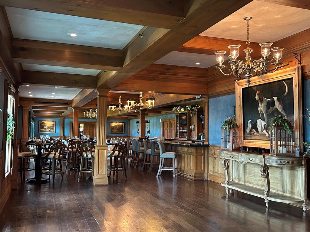 20 Bayhead Lane Osprey, FL 34229 - Photo 62 of 72 a view of a dining room with furniture window and wooden floor