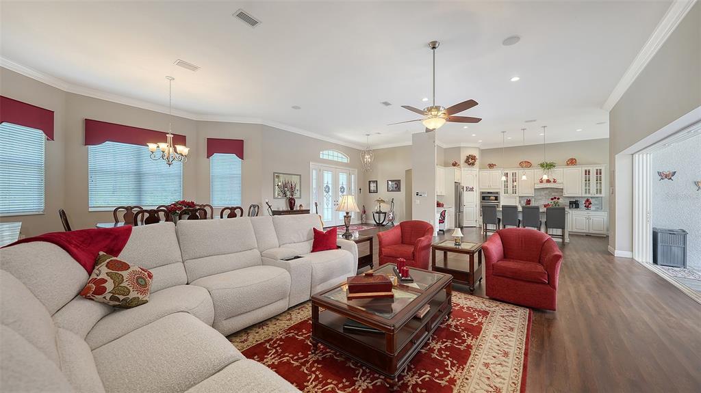 20 Bayhead Lane Osprey, FL 34229 - Photo 9 of 72 a living room with furniture kitchen view and a chandelier