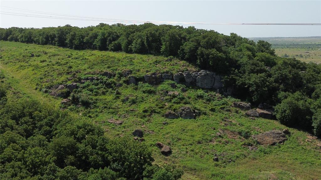 Tbd Nash Road Jacksboro, TX 76458 - Photo 15 of 28 Expansive acreage featuring natural rock outcroppings, mature tree lines, and varied topography