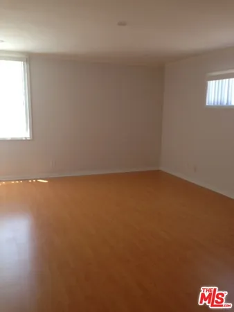an empty room with a empty space and window
