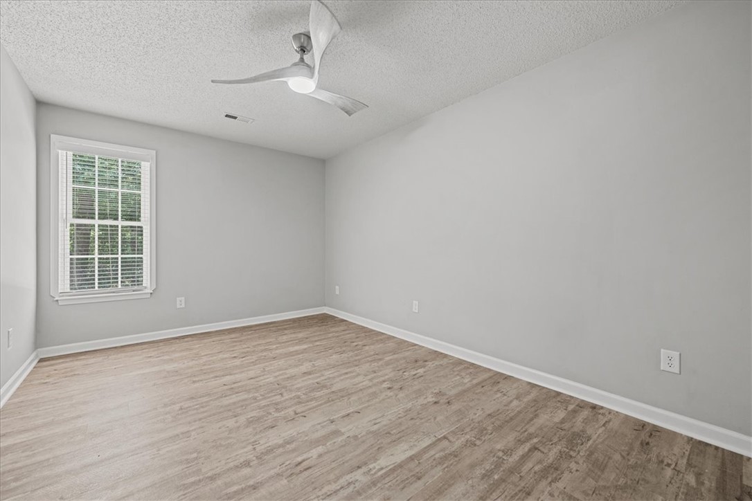212 Blue Ridge Drive Clemson, SC 29631 - Photo 25 of 33 A quiet bedroom with a contemporary ceiling fan, ideal for restful nights.