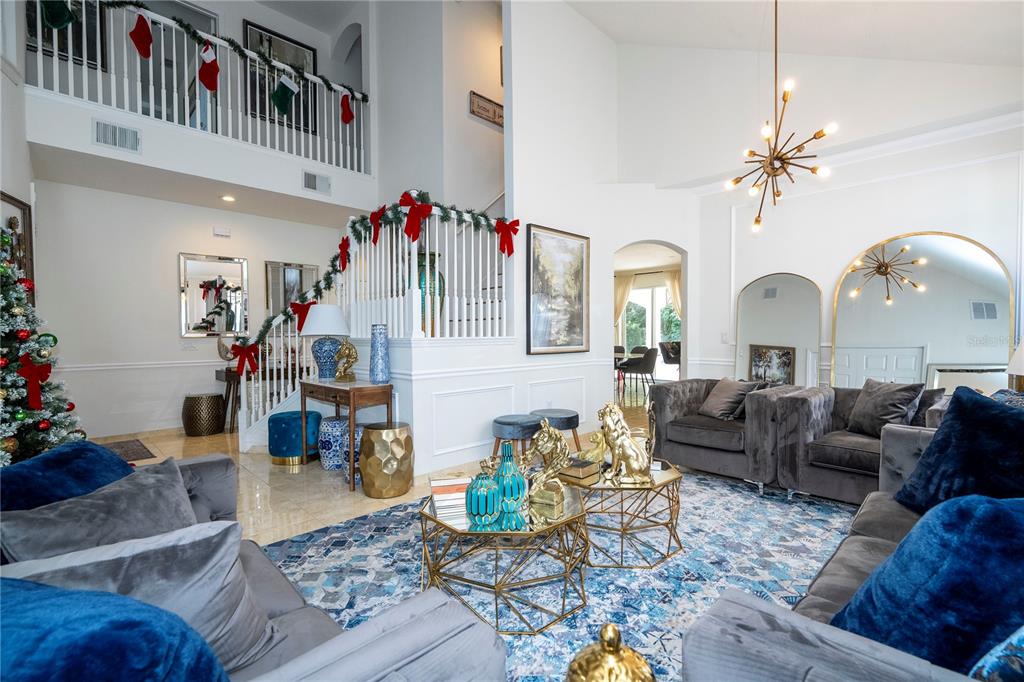 11410 Rapallo Lane Windermere, FL 34786 - Photo 11 of 62 a living room with furniture chandelier and rug