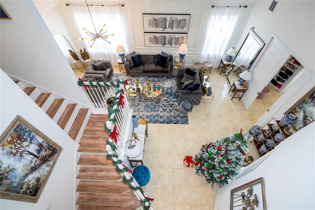 11410 Rapallo Lane Windermere, FL 34786 - Photo 13 of 62 a living room with furniture and flowers