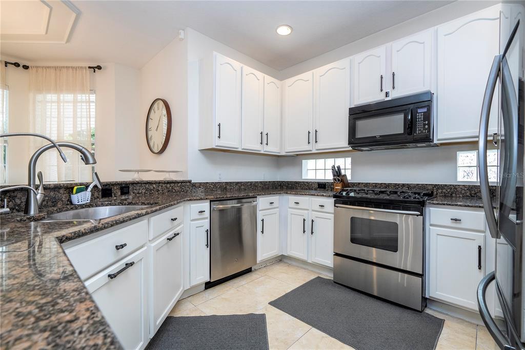 11410 Rapallo Lane Windermere, FL 34786 - Photo 17 of 62 a kitchen with appliances a sink and cabinets