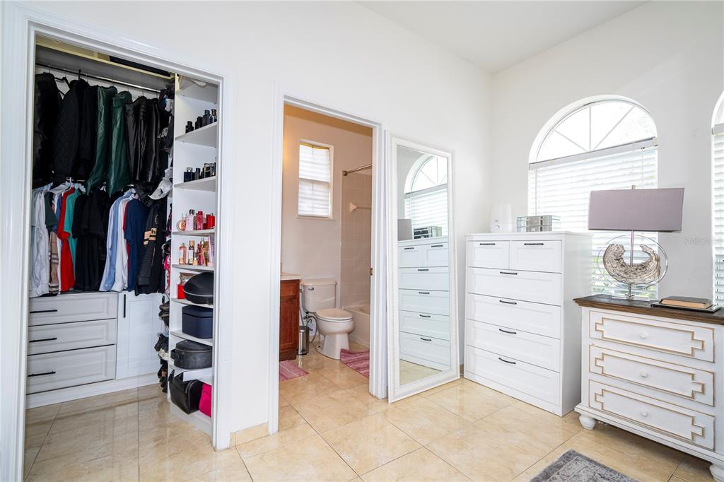 11410 Rapallo Lane Windermere, FL 34786 - Photo 24 of 62 walk in closet with clothes and shoes