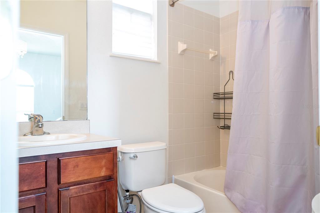 11410 Rapallo Lane Windermere, FL 34786 - Photo 25 of 62 a bathroom with a sink vanity mirror and toilet
