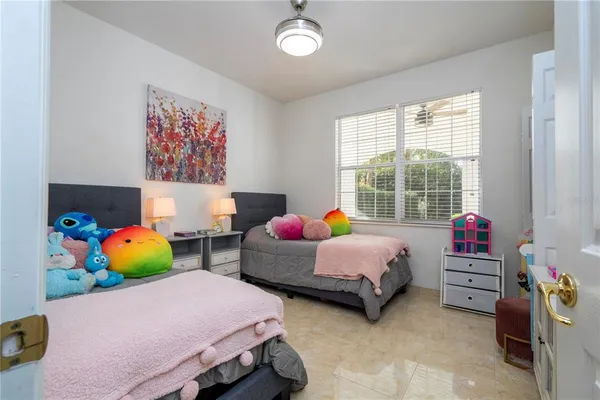 a spacious bedroom with a bed and window