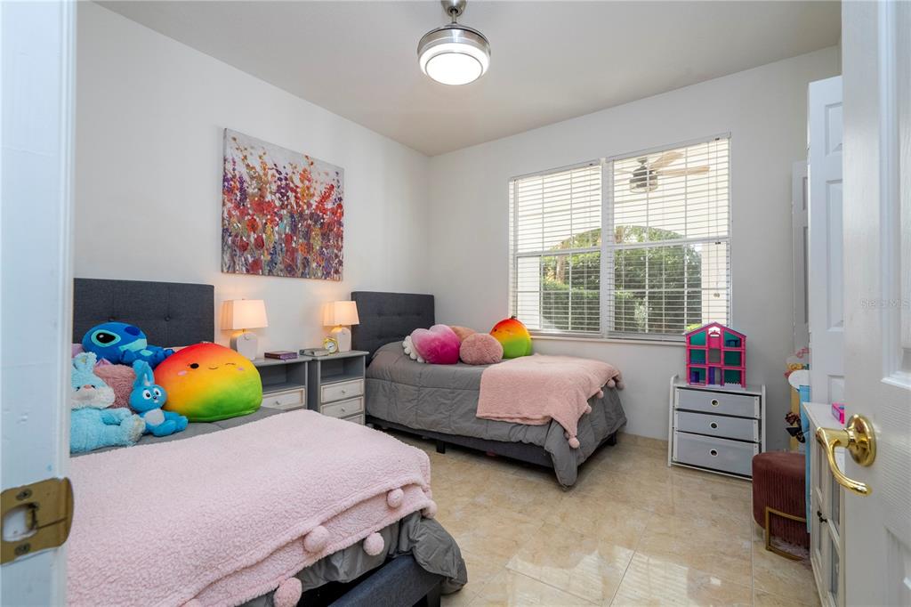 11410 Rapallo Lane Windermere, FL 34786 - Photo 26 of 62 a bedroom with bed and a window