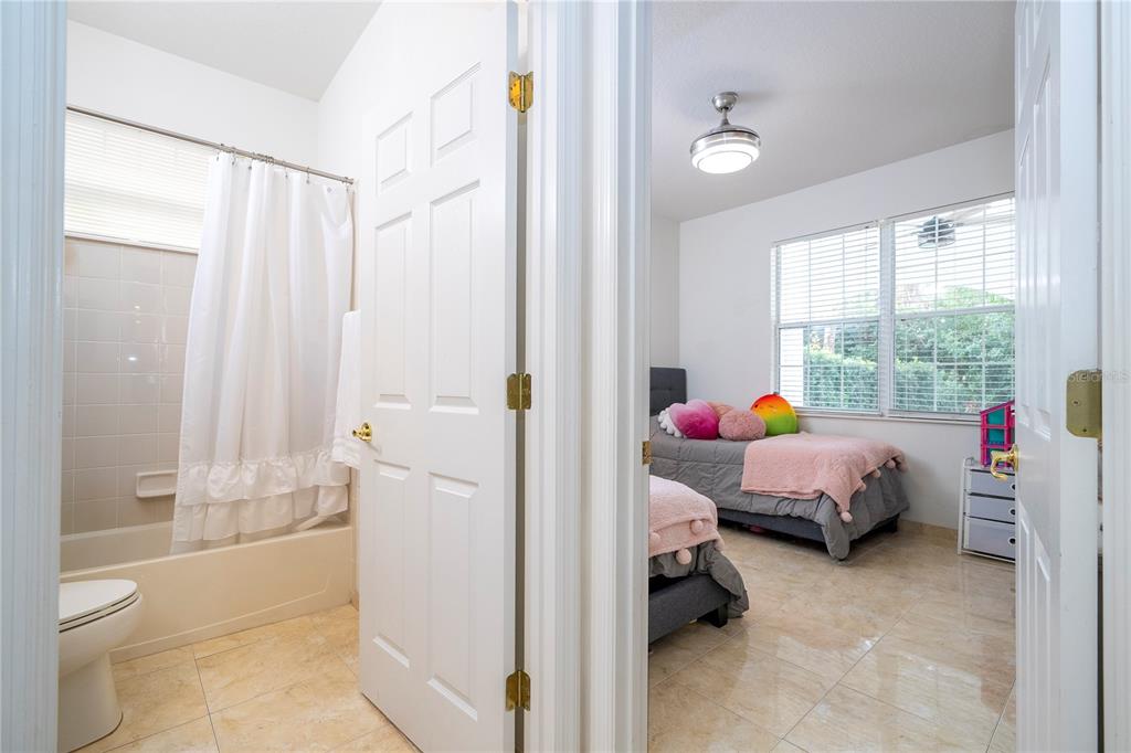 11410 Rapallo Lane Windermere, FL 34786 - Photo 28 of 62 a bed room with a bed and a window