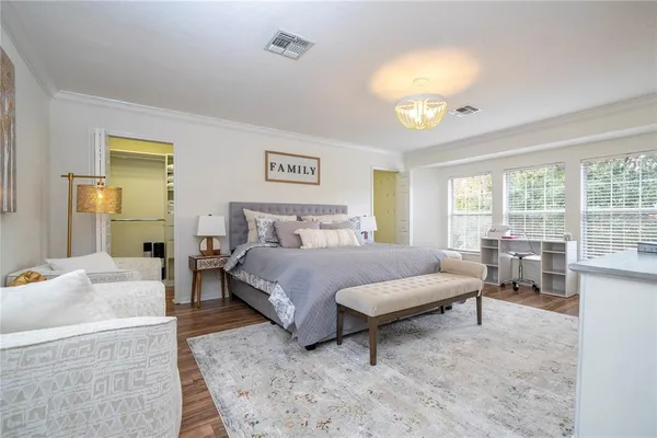 a bedroom with a bed and a couch