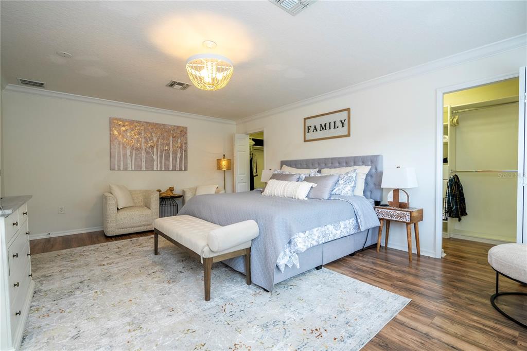 11410 Rapallo Lane Windermere, FL 34786 - Photo 32 of 62 a spacious bedroom with a bed and window