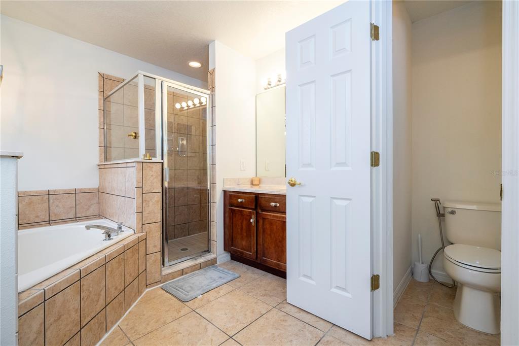 11410 Rapallo Lane Windermere, FL 34786 - Photo 35 of 62 a bathroom with a bathtub and a shower
