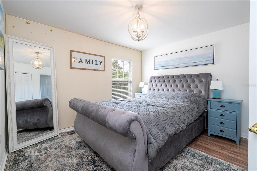 11410 Rapallo Lane Windermere, FL 34786 - Photo 37 of 62 a bedroom with a bed and a couch