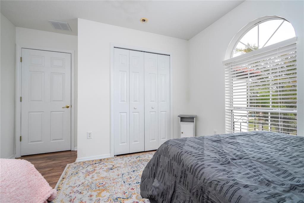 11410 Rapallo Lane Windermere, FL 34786 - Photo 42 of 62 a bedroom with a bed and a window