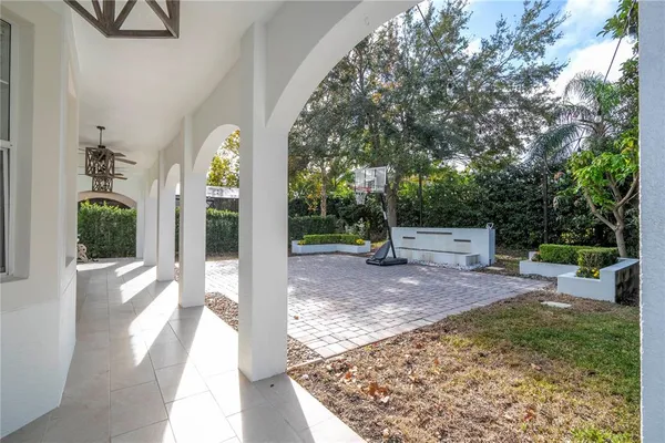 an aerial view of residential house with outdoor space and swimming pool