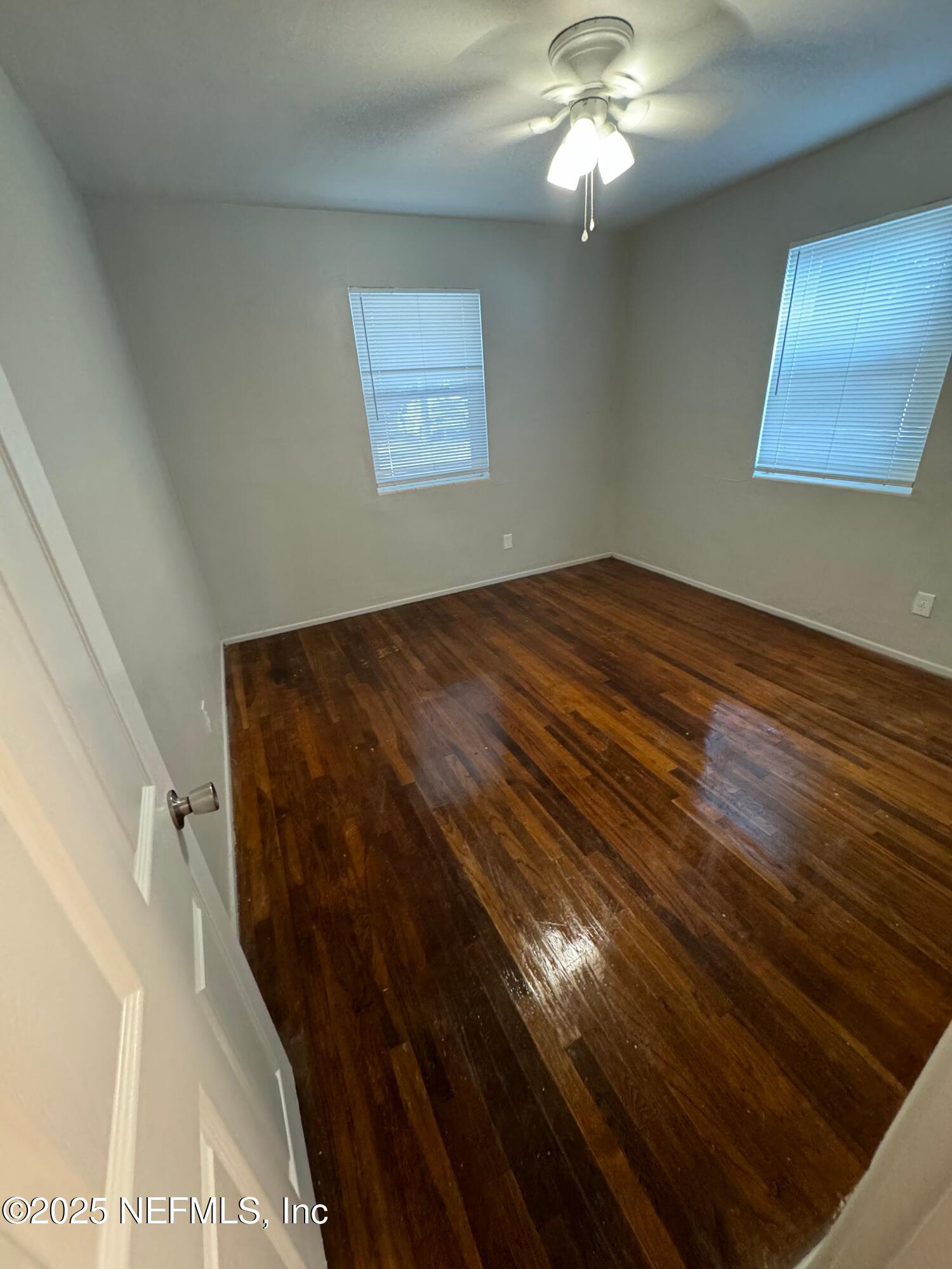 2117 Spring Park Road, Unit 1 Jacksonville, FL 32207 - Photo 2 of 9 a view of a livingroom with a ceiling fan and window