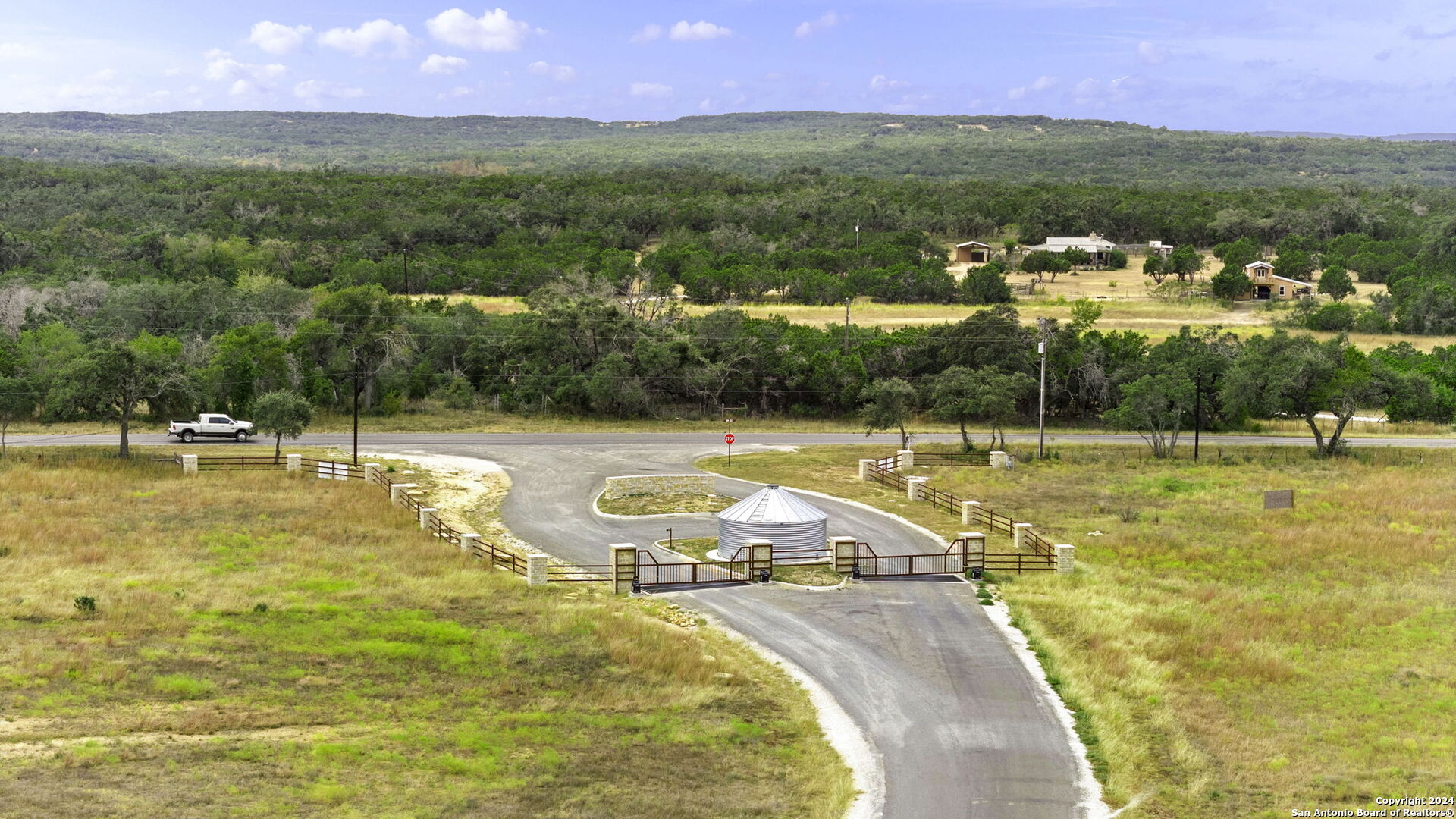 701 Windmill Ridge Blanco, TX 78606 - Photo 15 of 18 a view of a swimming pool with a yard and large trees