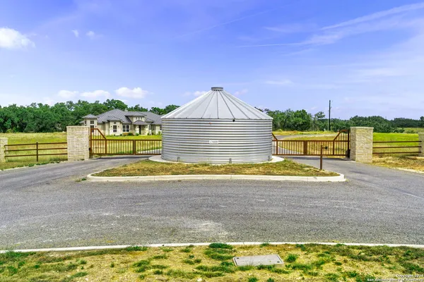 a view of a lake with houses in the back