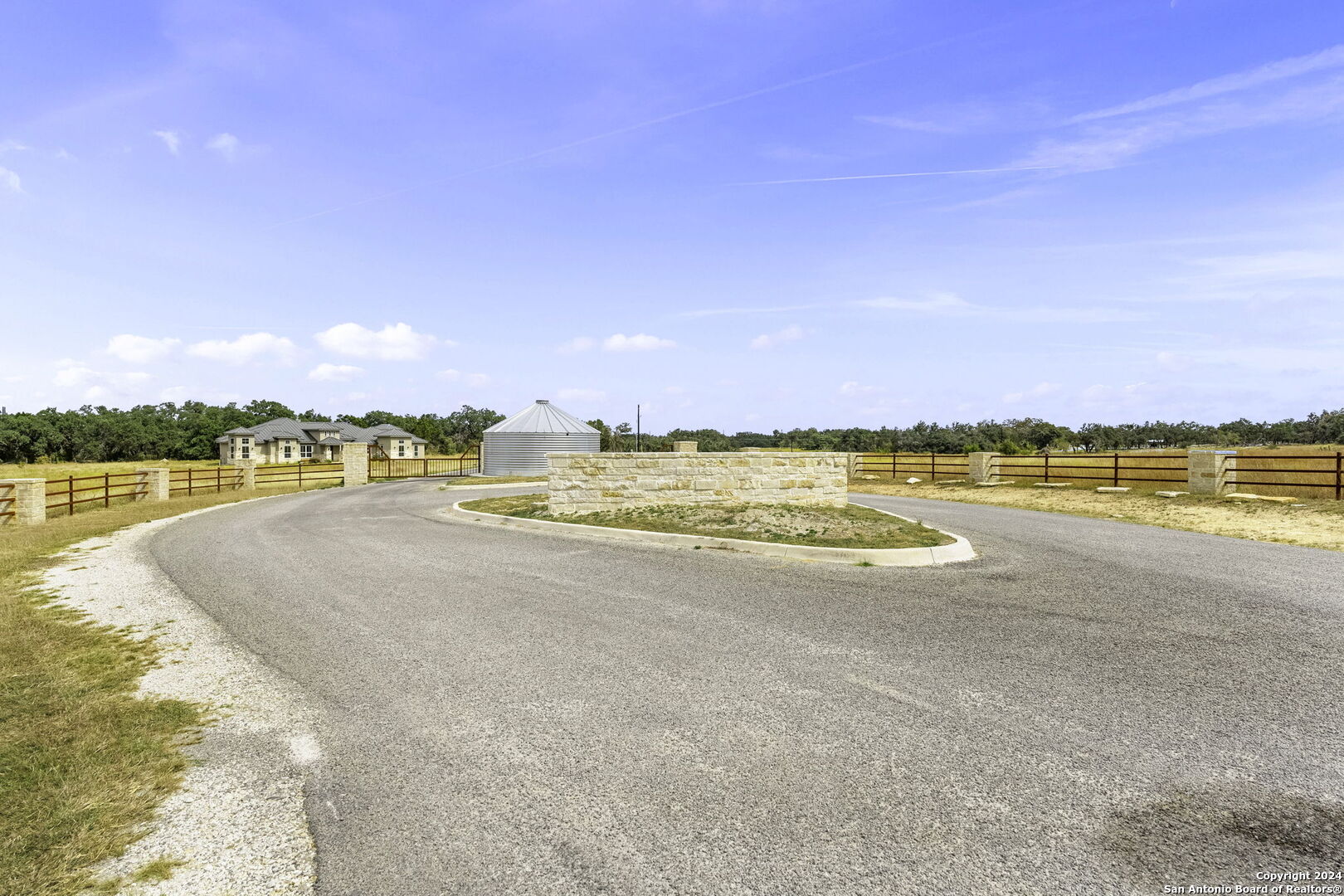 701 Windmill Ridge Blanco, TX 78606 - Photo 18 of 18 a view of a lake with houses in the back