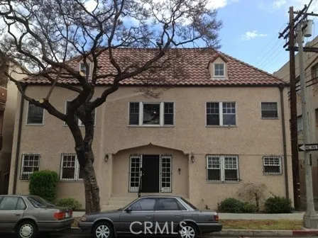 a front view of a house with parking space