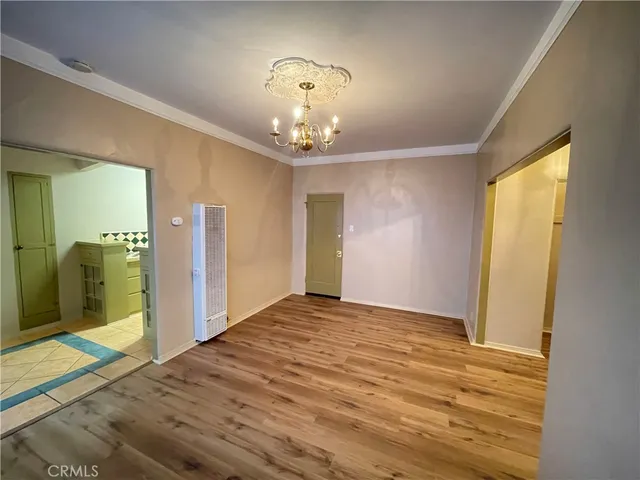 a view of an empty room with glass door