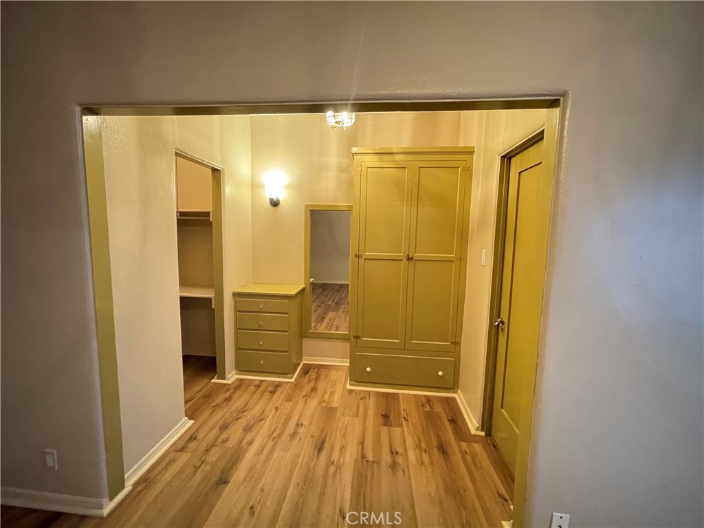 723 East 3rd Street, Unit 12 5 Long Beach, CA 90802 - Photo 4 of 8 a bathroom with a wooden floor