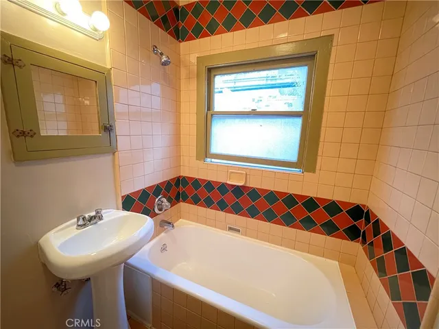 a bathroom with a sink and a bathtub