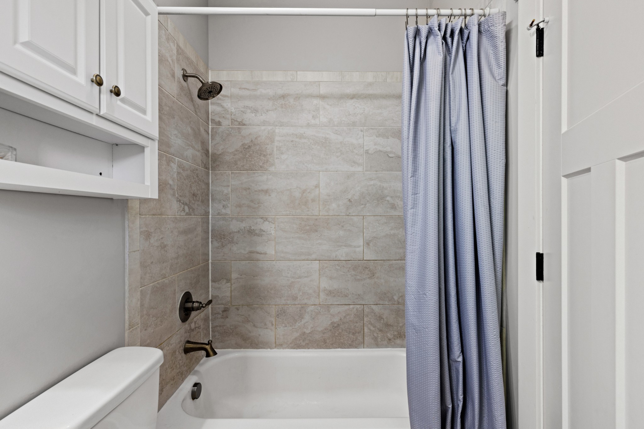 115 North Adams Street Adams, TN 37010 - Photo 27 of 44 a bathroom with a tub and shower