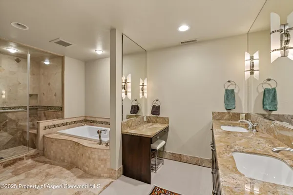 a bathroom with a bathtub and shower