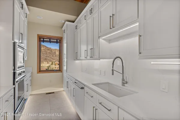 a kitchen with a sink and cabinets