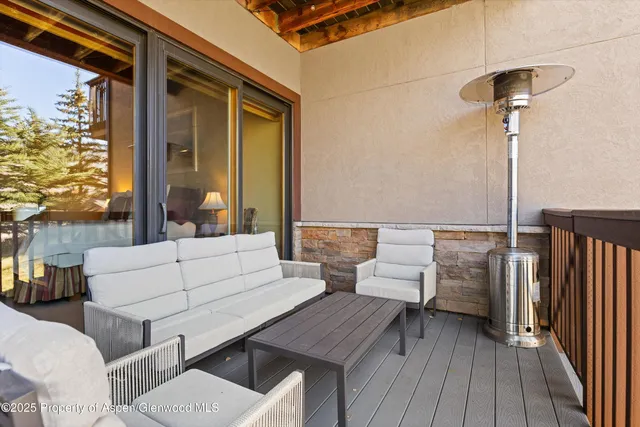 a outdoor space with patio the couches and a dining table with balcony view