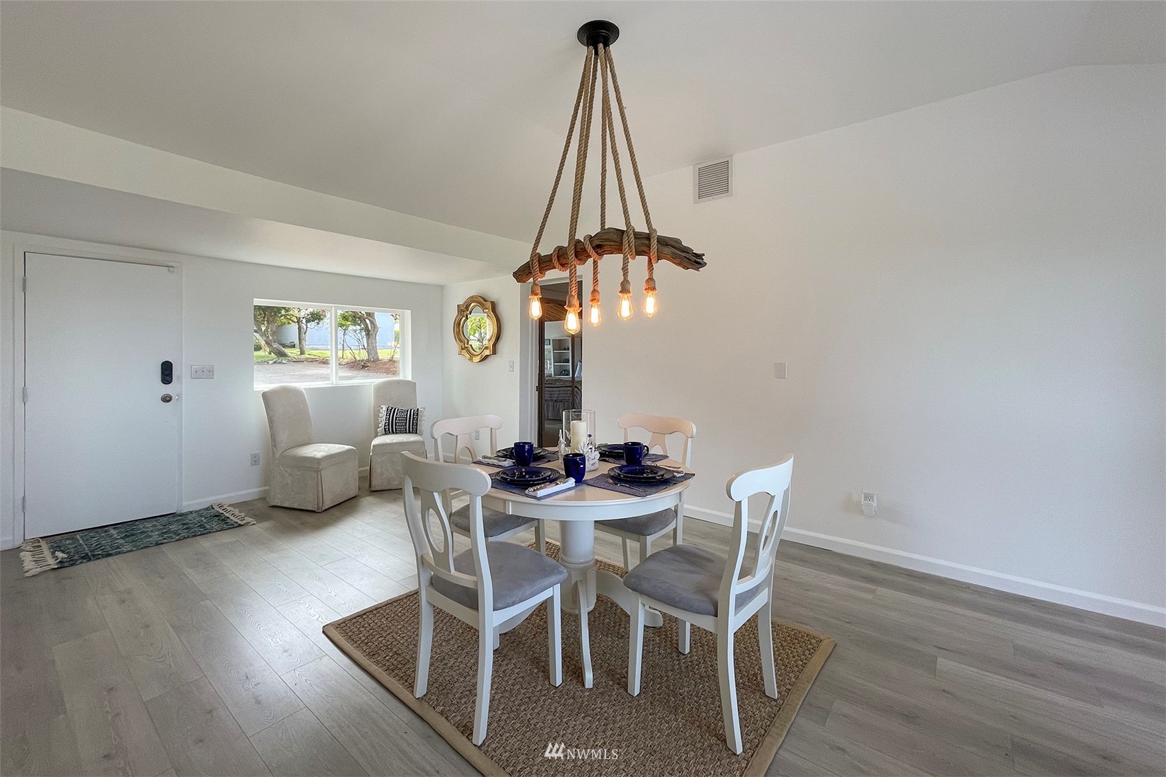 622 West Anderson Road Sequim, WA 98382 - Photo 15 of 40 a view of a dining room with furniture and wooden floor