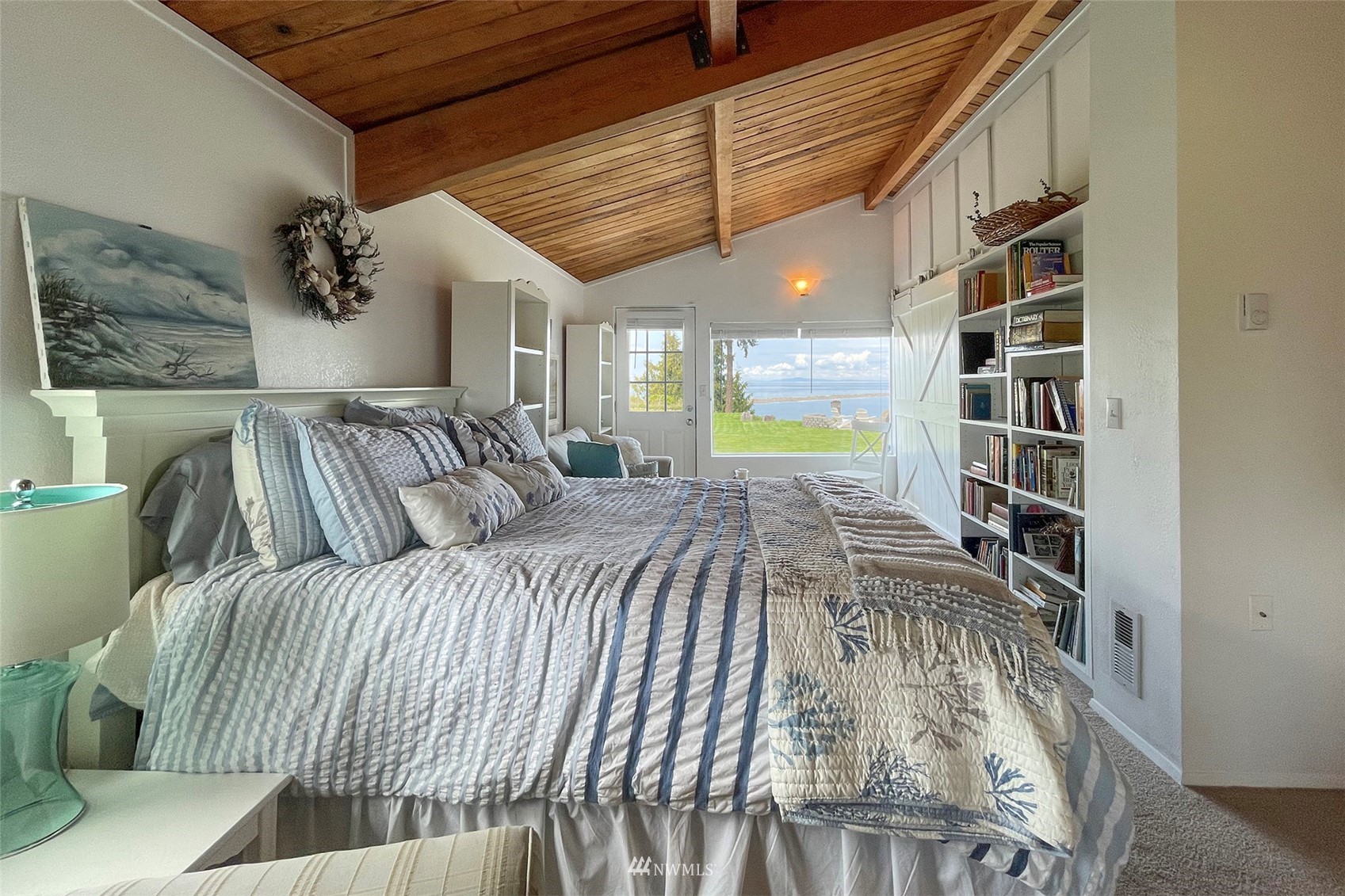 622 West Anderson Road Sequim, WA 98382 - Photo 23 of 40 a bedroom with a bed and a book shelf